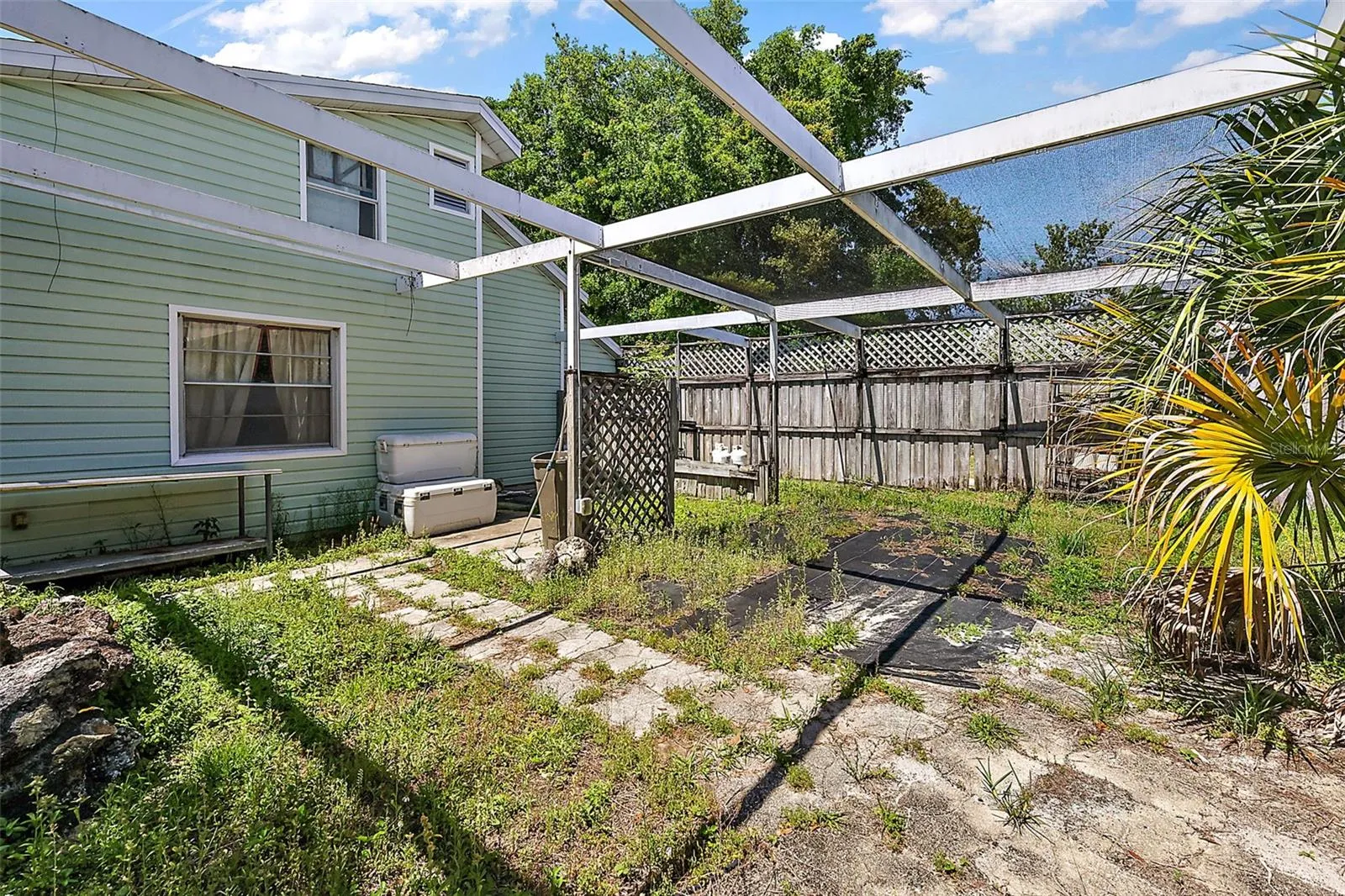 fenced in yard off apartments.