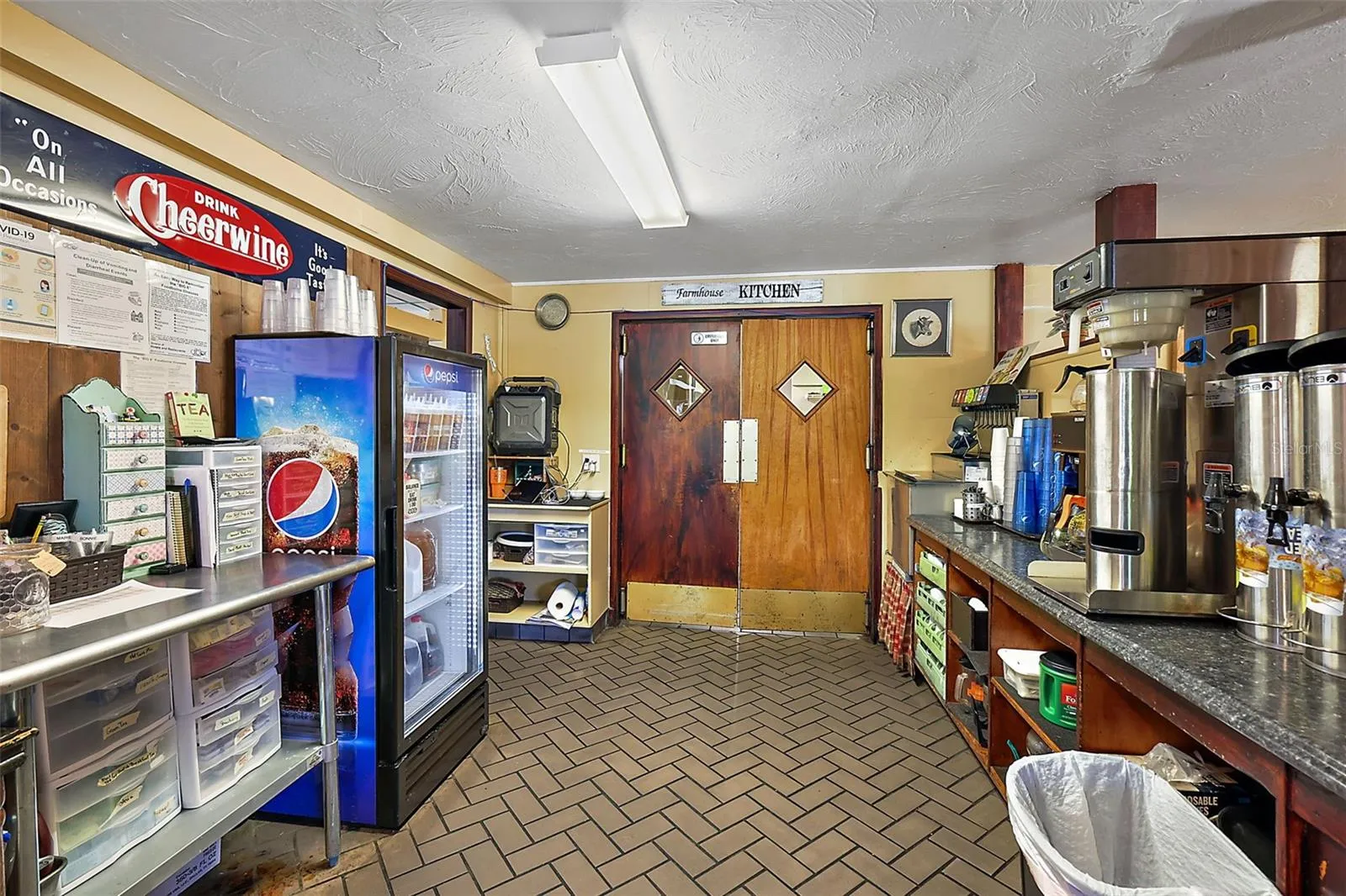 Front service area drinks and coffee looking toward kitchen entrance