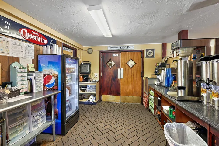 Front service area drinks and coffee looking toward kitchen entrance