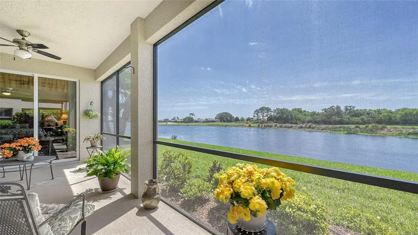 River Strand deeded golf ground floor coach home with double lake and golf course views.
