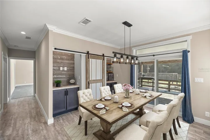 Dining Area with Builds ins---and door to secret, Virtually Staged