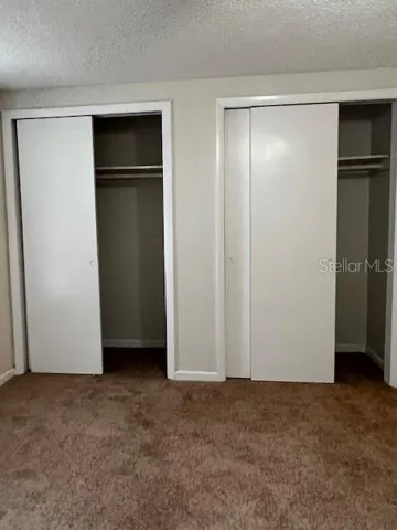 Primary bedroom. his & her closets