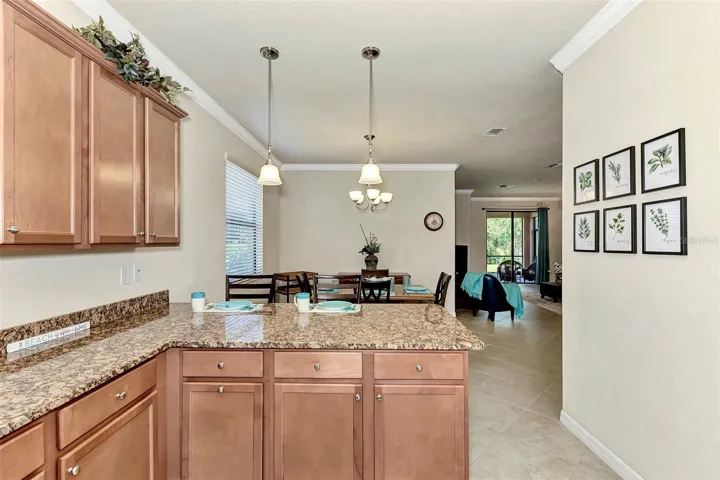 Granite Counters and Pendant Lighing with/Crown Molding