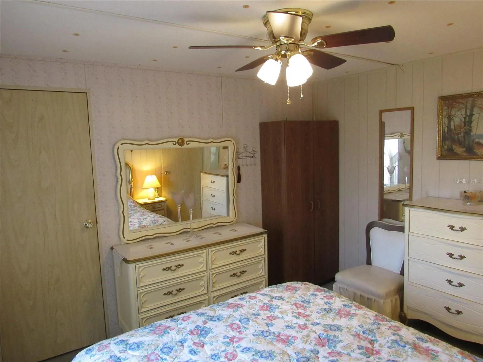 Primary bedroom with walk-in closet.