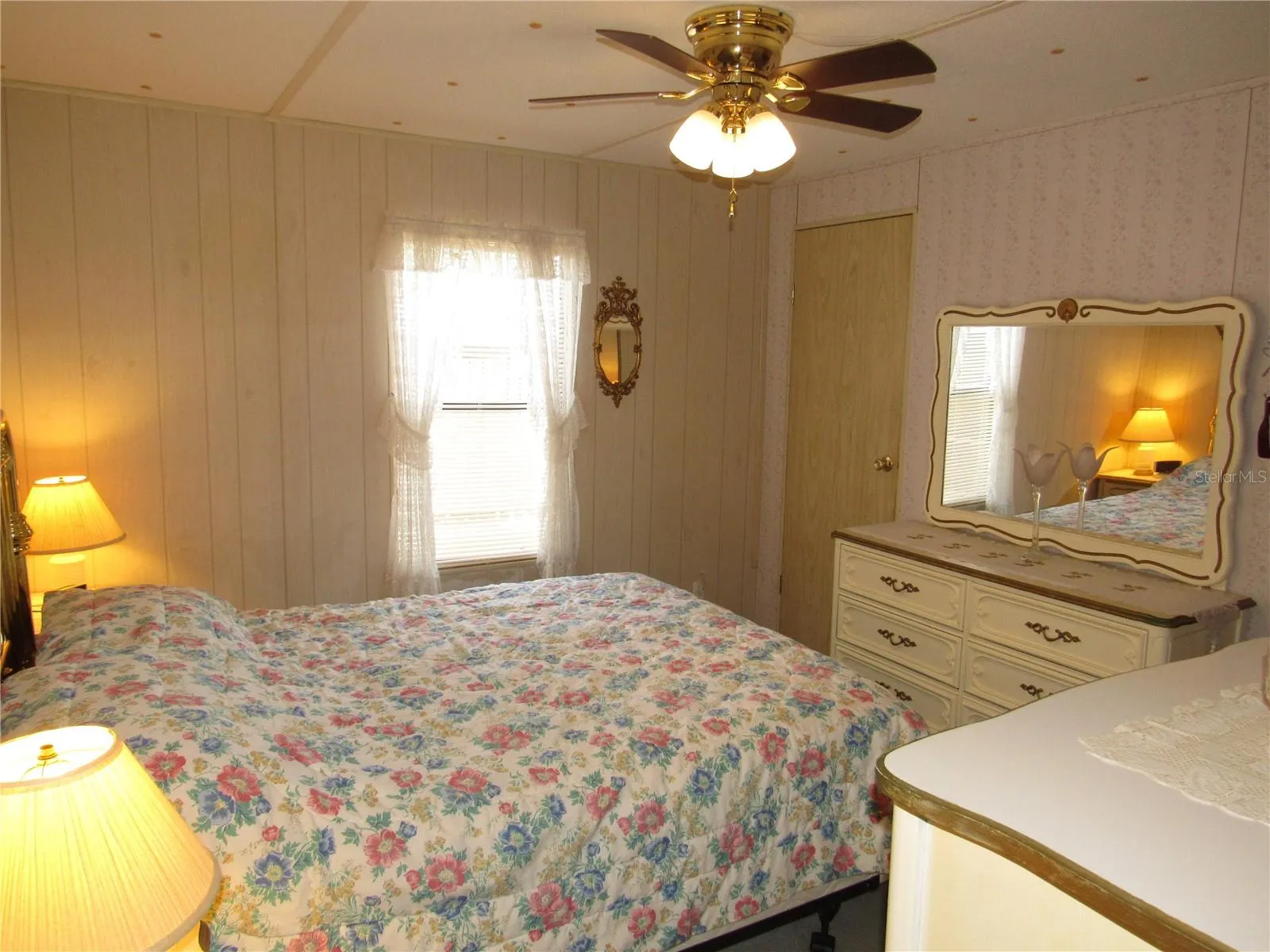 Primary bedroom with walk-in closet.