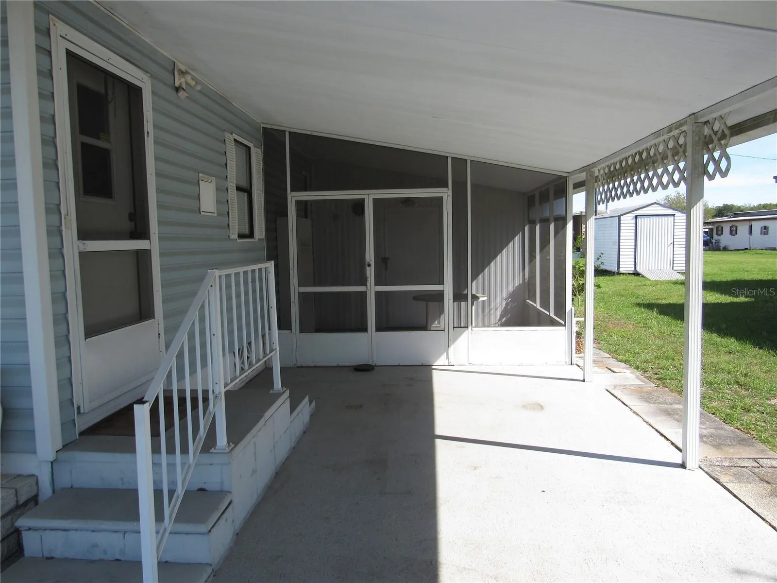 Main entry &amp; attached screen porch.