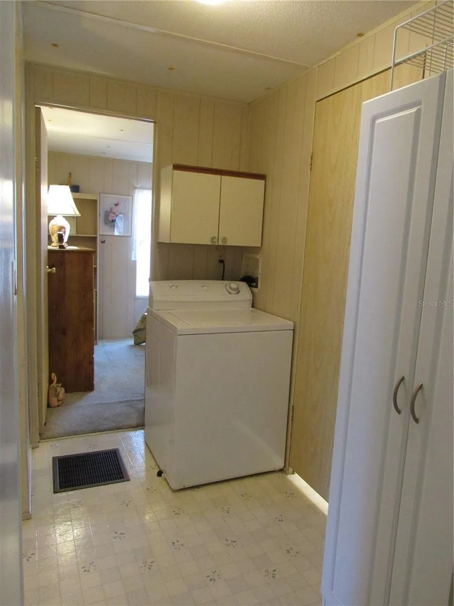 Hallway with washing machine.