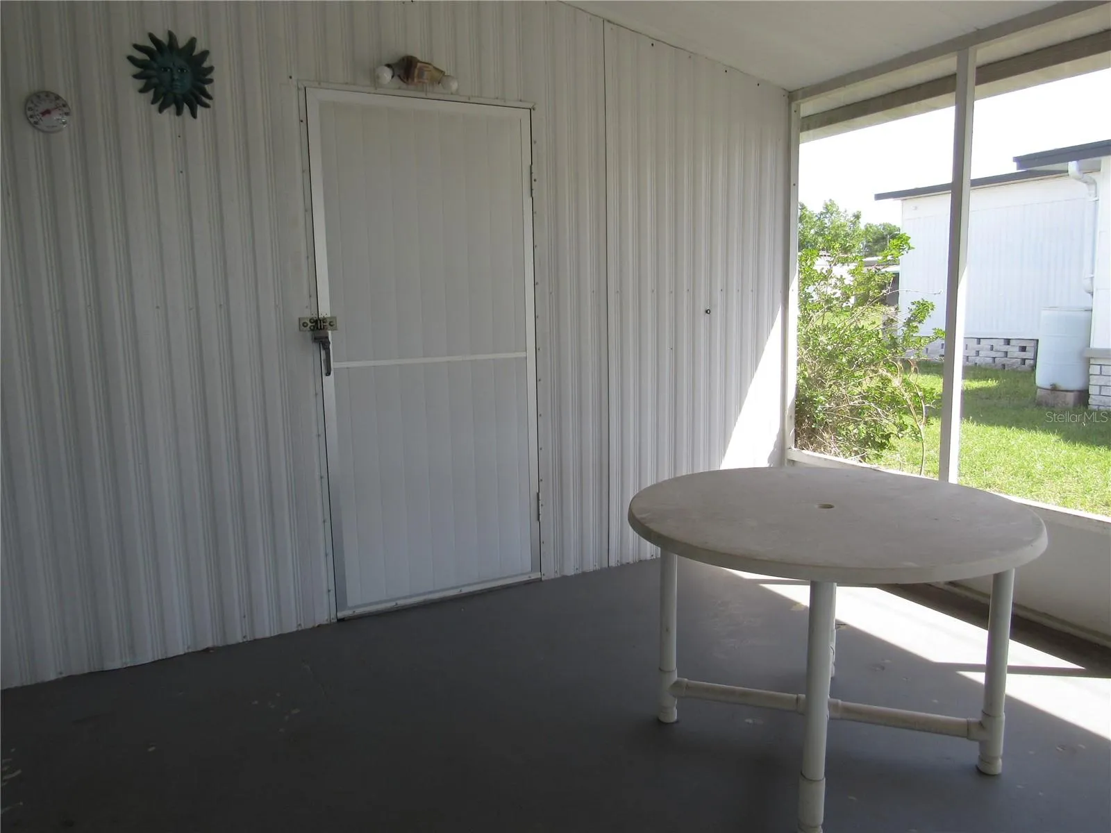 Attached screen porch &amp; utility room entry.