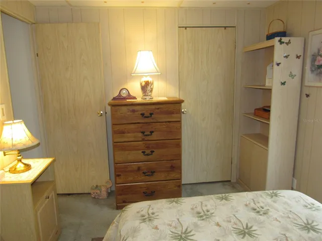 Guest bedroom with walk-in closet.