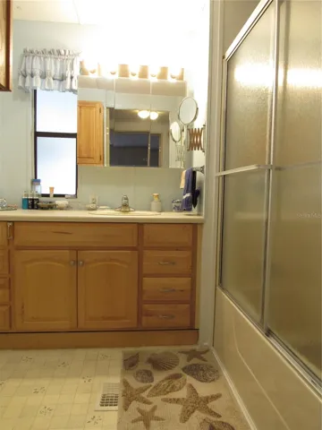 Jack & Jill style bathroom with access from hallway & guest bedroom.