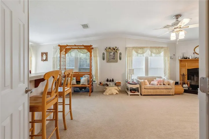Family room is located at the back of this home with wood burning fireplace.