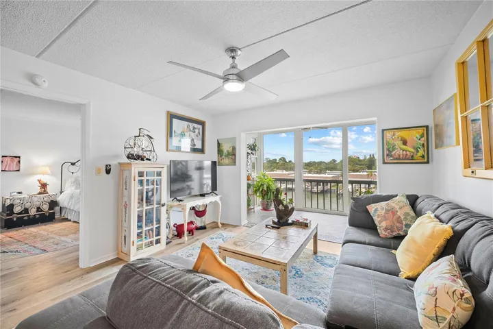Living room with enclosed balcony looking at the Intracoastal Waterway canal
