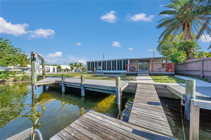 Waterfront looking towards the  composite decking and boat lift from the floating dock