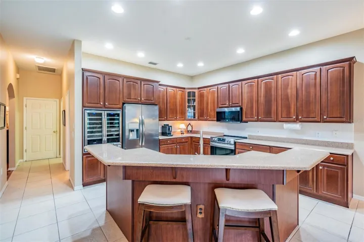 Open kitchen with breakfast bar seating