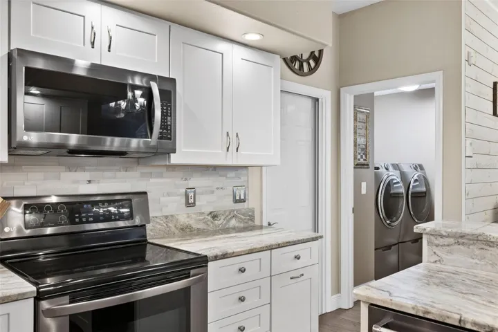 Laundry room washer and dryer hookups off the kitchen. *washer and dryer do not convey