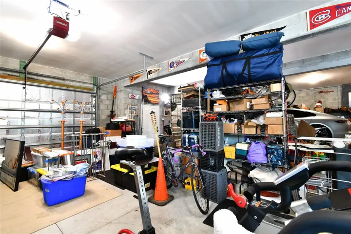 So many options with this ground floor area for vehicles, storage, warehousing, media room and more.  Fully under air.