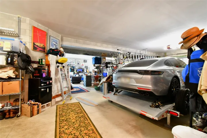Huge ground floor square footage with room for four vehicles or keep the media room in place.  Great for warehousing, storage, bonus rooms, California closets.