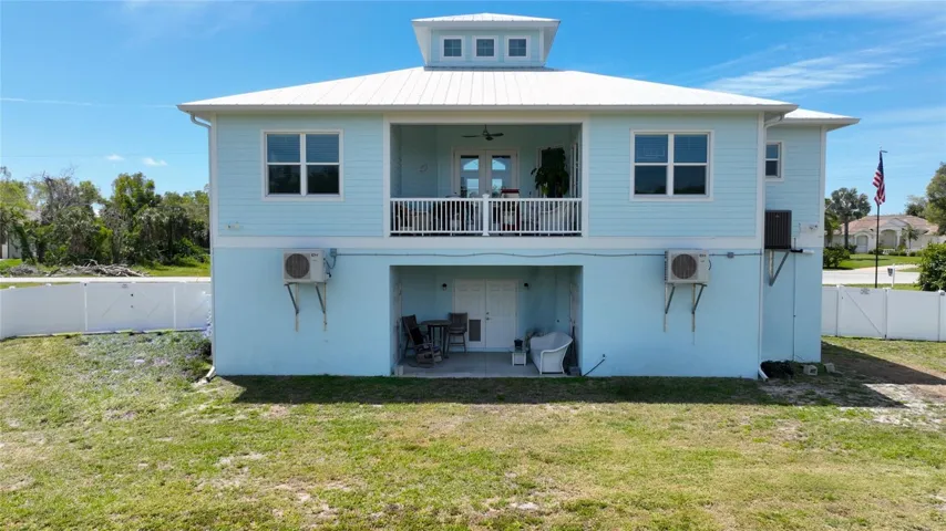 Enjoy this large backyard with privacy fencing, ground floor porch and 2nd floor balcony.