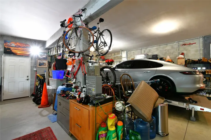 Perfect for the vehicles, storage and equipped with California Closets and currently features a wonderful media room.