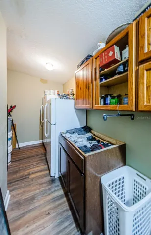 This is a big storage area off the Family Room with cabinets and refrigerator
