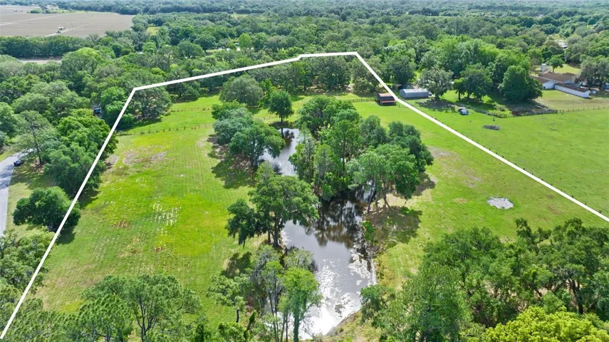 This image is facing McIntosh Road towards the top of the image. To the left is the Stonelake Ranch McIntosh Entrance.