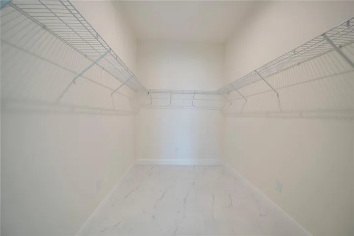 MAIN CLOSET - SPACIOUS WALK IN CLOSET