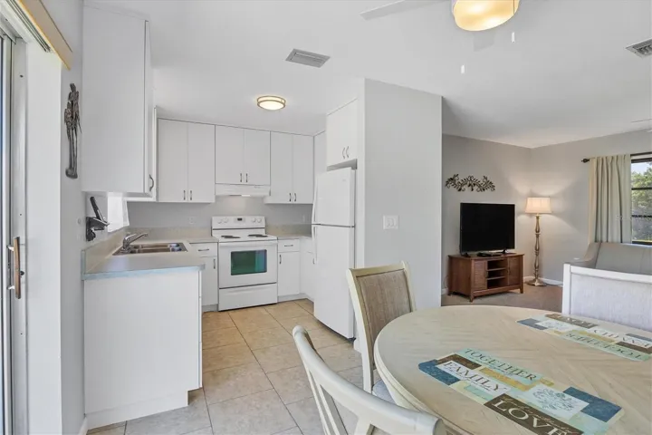 open view kitchen, partial dining and living room