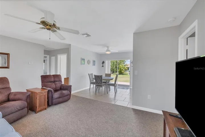 another view from far corner of living room, short hall to left is bedroom 2 and bath 2