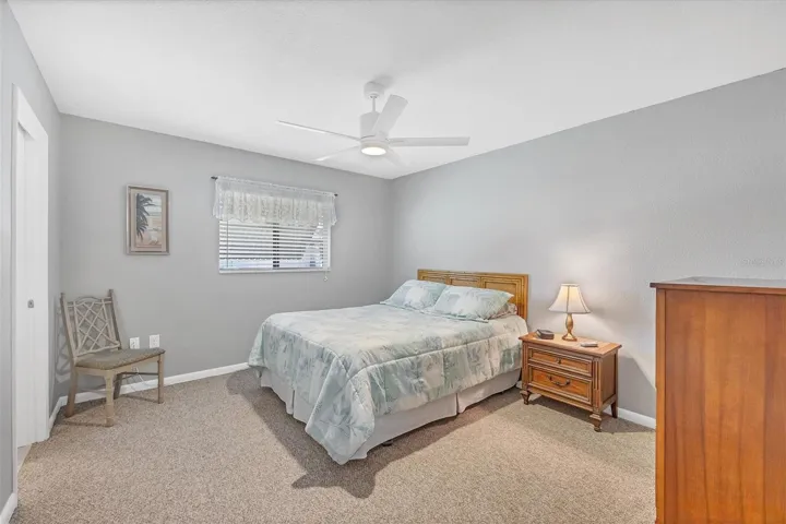 primary bedroom boasts walk in closet and en suite bath