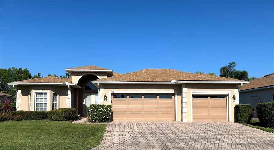 front of home w/ enlarged driveway
