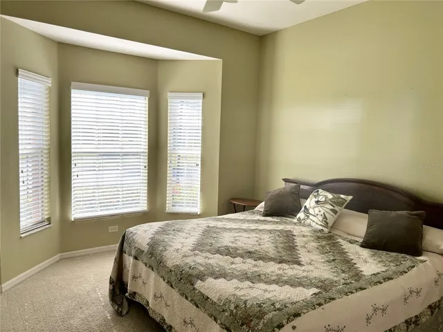 guest bedroom w/ bay window