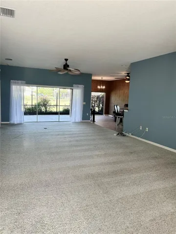 overlooking great room and formal dining upon walking in double glass doors at entry