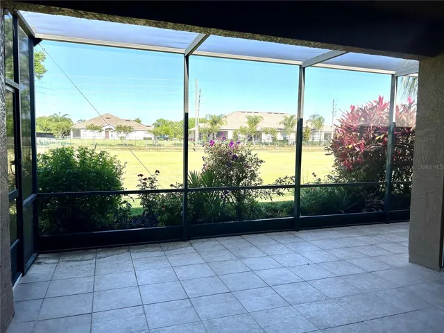 oversized tiled, roofed & screened veranda