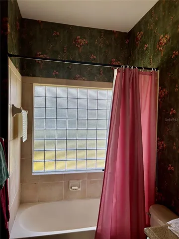 guest bath showing large glass block in guest bath