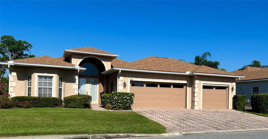 front of home w/ 3rd car garage and oversized driveway