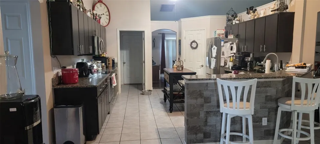 Well appointed kitchen that will making your family meals a breeze.  Lots of cabinet storage along with walk in pantry