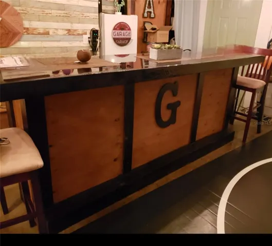 Handmade adult entertainment space in garage