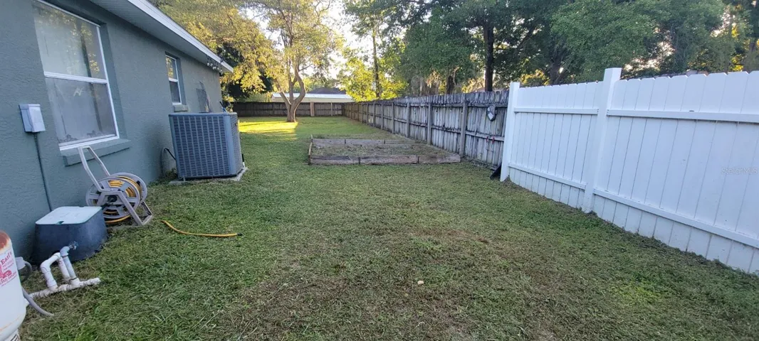 Side yard with raised beds