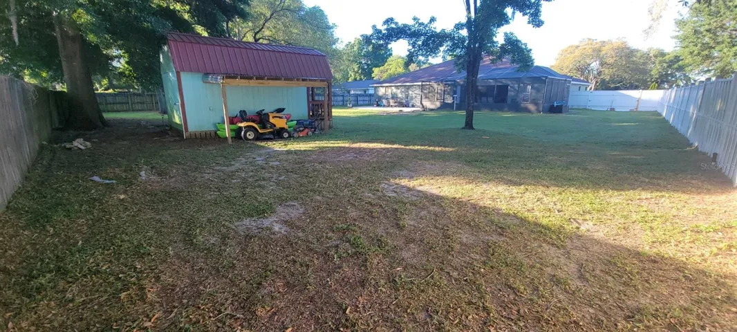 Shed with covered storage area (see notes regarding shed)
