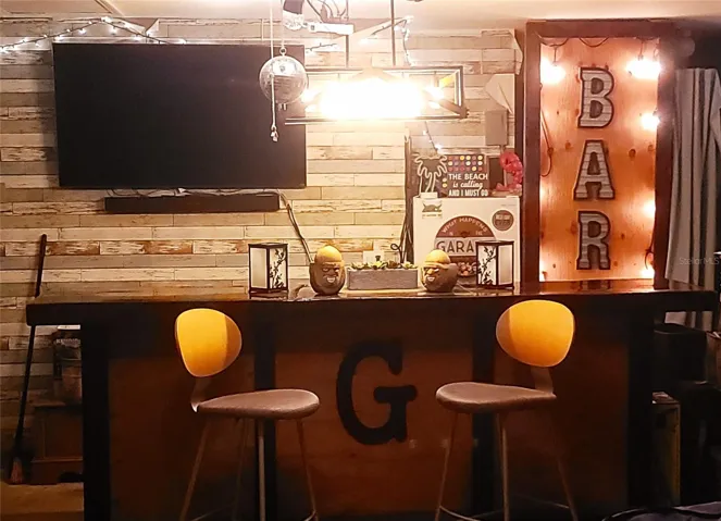Sports bar with wood look wall in garage