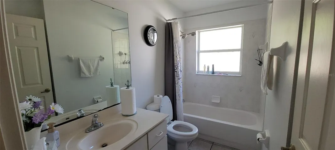 Guest Bath with Tub Shower and large sink area