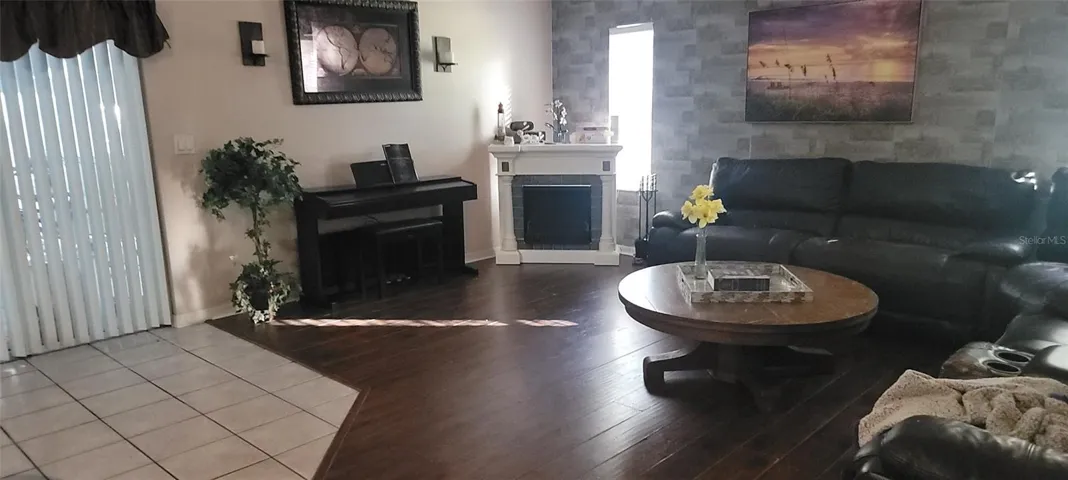 Laminate flooring along with tile makes for a warm inviting look