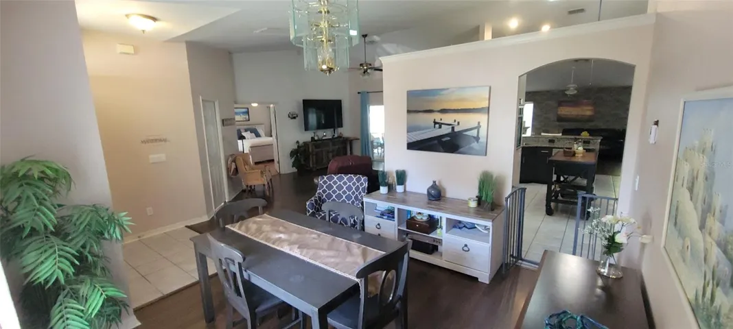 Formal dining room looking into kitchen and family room