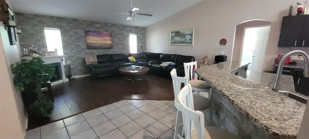 Bar stool area in kitchen along with 