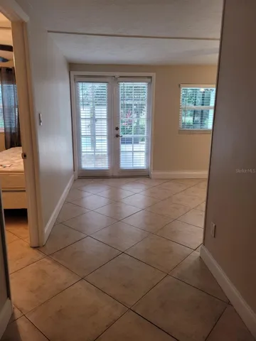 Leading to dining room and french doors to pool