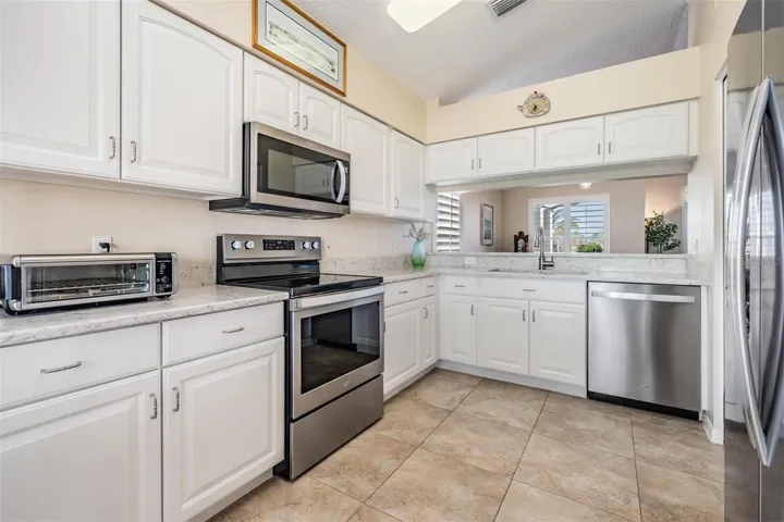Crisp, white kitchen new, stone countertops