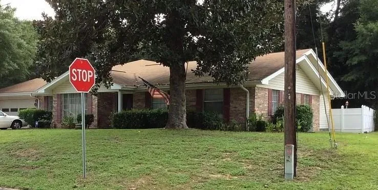 EXTERIOR FRONT AND SIDE OF HOUSE