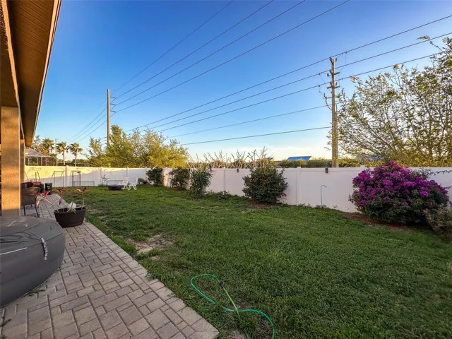 Large yard, white vinyl fenced .