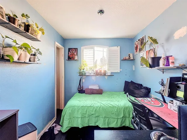 Upstairs Bedroom 2with walk in closet and plantation shutters
