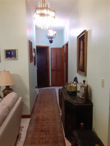 Hall to 3 of 4 bedrooms